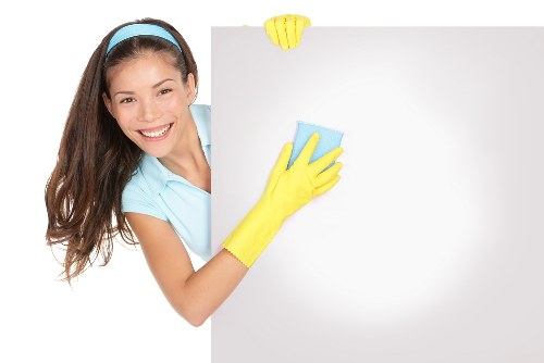 Cleaner removing stains from a carpet in Norwood Green